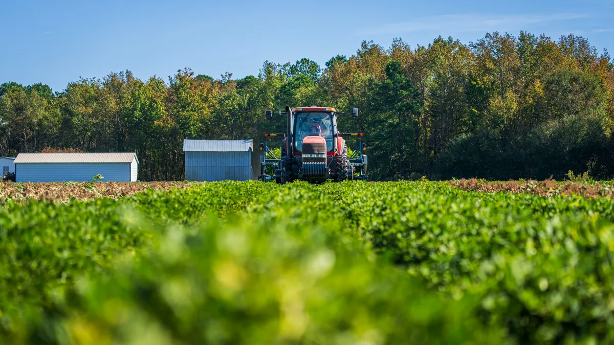Tractor operating in a farm field